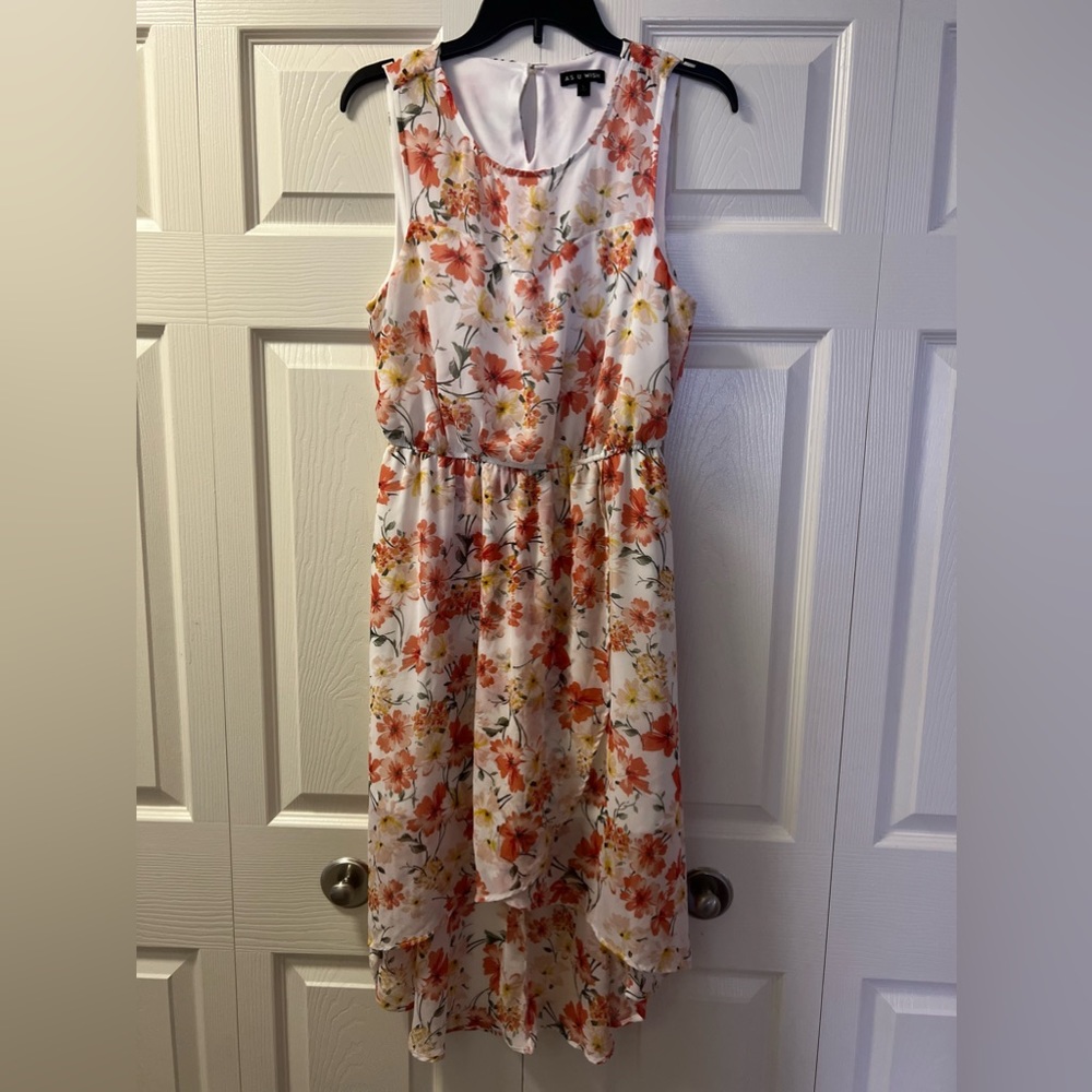 A floral dress is a lovely and feminine choice.